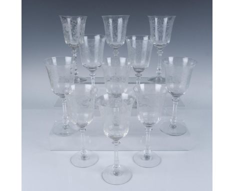 This intricately detailed set of eleven crystal drinking glasses features a lovely etched floral orchid design. The etching e