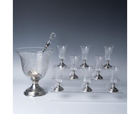 A striking 10-piece sterling silver and glass punch set, comprising a large punch bowl, a ladle with a crystal handle, and ei