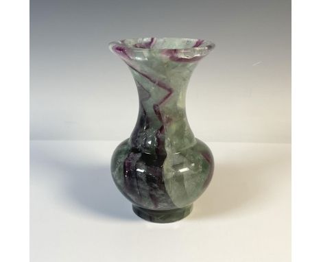 Heavy bouquet vase, carved and polished to a high gloss. The jade coloration is broken up with veins of eggplant. Dimensions: