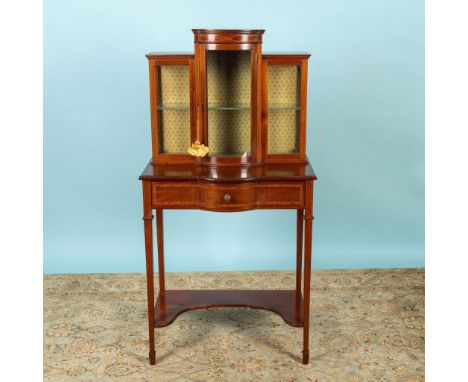 Antique Edwardian cabinet with outlined design. Cabinet has bow front glass with internal glass shelf and locking center door