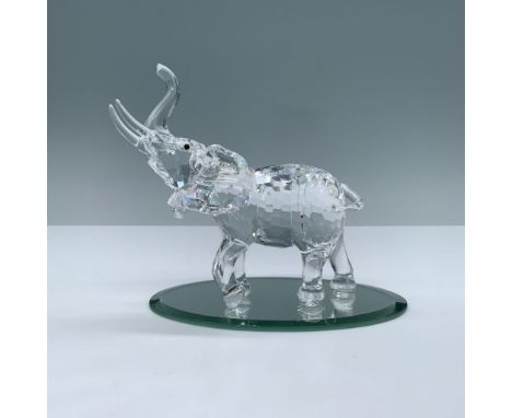 Figural has clear faceted crystal body with black button crystal eyes with trunk up. Swarovski swan mark. 678945. This item h