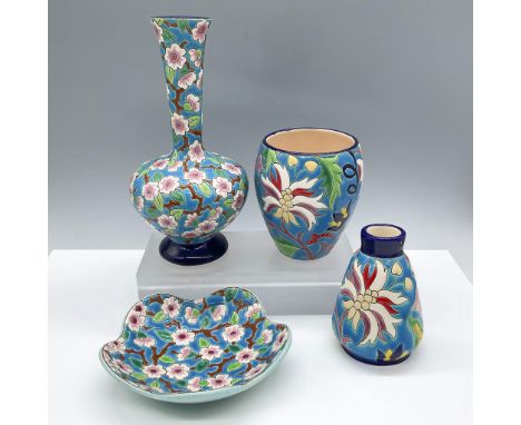 Beautiful collection of four vibrant French faience ceramic pieces, showcasing intricate hand-painted designs typical of trad