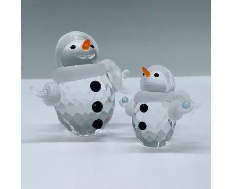 Includes 1 small faceted crystal figurine modeled as a tiny snowman holding light blue snowballs in each hand. Figurine has a