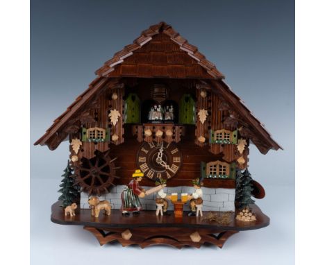 8 day rolling pin cuckoo clock 8TMT 697/9. Dual melody high quality Swiss music movement. The Lady swings her rolling pin to 