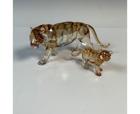 Stunning pair of faceted Swarovski Crystal figurines that features a mother tiger 1003148 and her cub 1051686, expertly craft