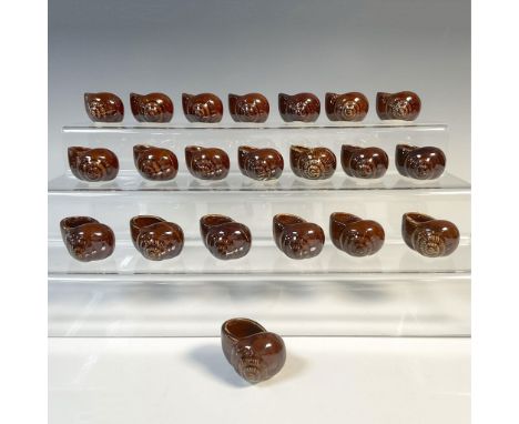 Twenty-one dark brown glazed shells from Hall Ceramics. These can be used for serving escargot or as salt or spice dips. Stam