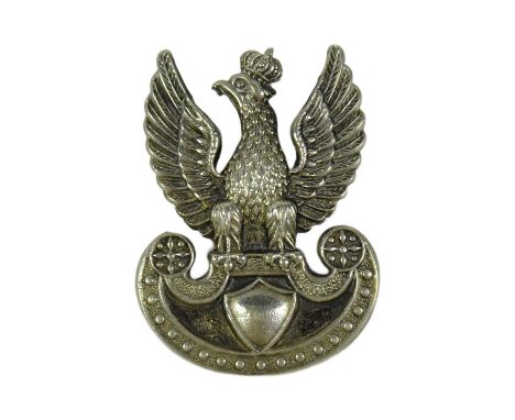 A WWII Second World War Free Polish Army cap badge depicting a crowned winged eagle atop an Amazon shield. Screw to verso.