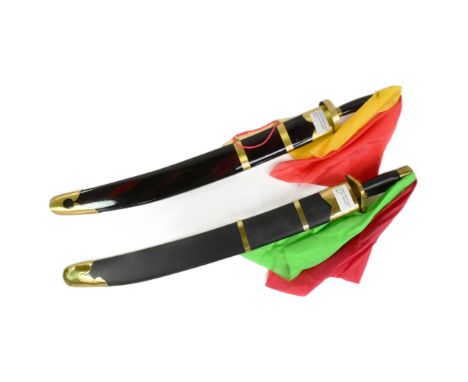 Three martial arts / kung-fu broadswords with sashes. One sword sharing the same scabbard. Each measuring approx 100cm.

If t