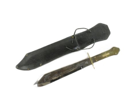 A vintage Colt Peacemaker bowie knife with coffin style hilt, brass crossguard and commemorative Colt's Peacemaker etching to