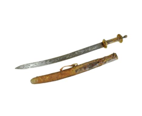 An early 20th Century North African / Sudanese short sword. Ribbed metal pommel, crocodile skin grip and oval animal hide gua