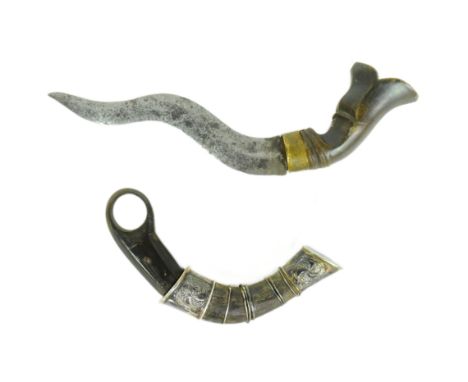 Two 19th Century Indonesian daggers comprising a&nbsp;Karambit / Lawi Ayam claw knife with finger loop and silver mounted sca