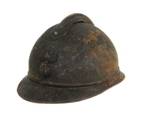 A WWI First World War period French Infantry M15 steel combat Adrian helmet. Steel construction with split pin ' comb ' and '