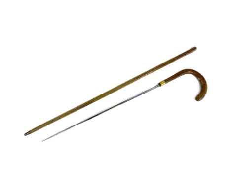 A 19th Century Victorian gentleman's sword stick with concealed Toledo blade. Crooked wooden handle with rolled gold band wit