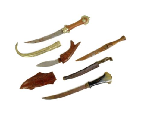 A collection of x4 assorted African Ethnic knives and daggers to include a Moroccan Koummya / Jambiya with a Rhino horn hilt,