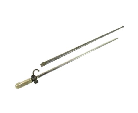 A 19th Century French Lebel Rifle ' Epee ' bayonet. The bayonet having an early nickel hilt, push release button to the cross