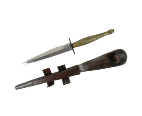 A WWII Second World War British FS Fairbairn Sykes 2nd Pattern commando fighting knife dagger. Typical form with a chequered 