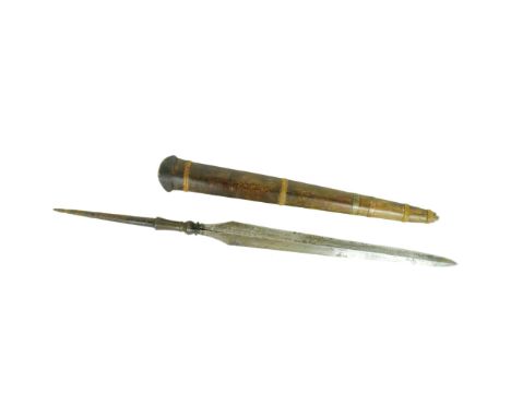 An early 20th Century Indonesian Tombak spear head. Tapering blade with a raised central rib housed in a wooden scabbard with