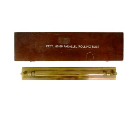 A military brass parallel rolling rule. Stamped Pat No 160100 with broad arrow. Measures approx length 46cm. Housed in a stai