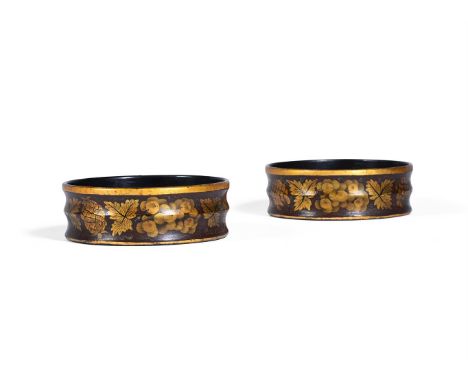 A PAIR OF REGENCY PAPIER-MÂCHÉ BOTTLE COASTERS EARLY 19TH CENTURY each 4.5cm high, 14cm diameter   Condition Report:  Overall