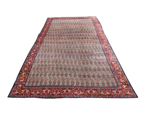 A LARGE SENNEH CARPET 19TH CENTURY  Decorated with an all over design of boteh  approximately 780 x 460cmProvenance:  From th