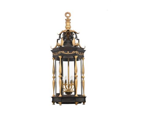 A LARGE PATINATED AND GILT METAL HANGING LANTERN  IN THE FRENCH REGENCY MANNER, 20TH CENTURY  Of shaped hourglass form with s