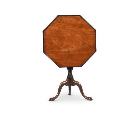 A GEORGE II FIGURED MAHOGANY OCTAGONAL TRIPOD TABLE CIRCA 1750 The single piece top with moulded raised edge supported on a r