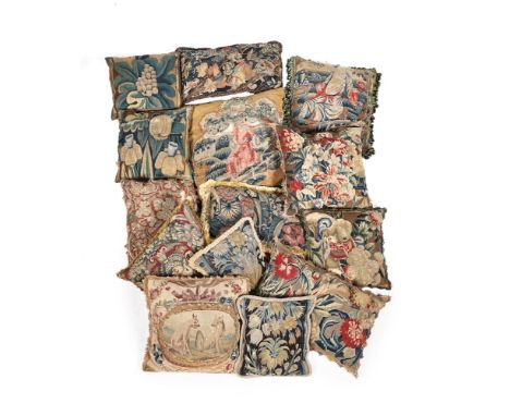 A GROUP OF FOURTEEN TAPESTRY PANEL CUSHIONS 18TH CENTURY AND LATER Of various sizes and designs, the largest approximately 54