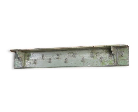 A GREEN PAINTED HANGING SHELF AND COAT RACK PROBABLY PENNSYLVANIA OR NEW ENGLAND, LATE 18TH OR EARLY 19TH CENTURY 23cm high, 