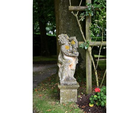 TWO SIMILAR STONE COMPOSITION FIGURES OF CHERUBS ON PLINTHS  20TH CENTURY the larger 149cm high overall, the figure 90cm high