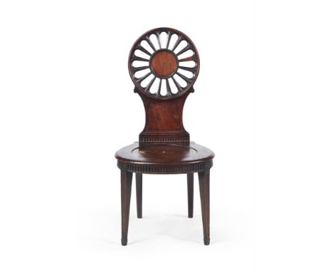 A GEORGE III MAHOGANY HALL CHAIR IN THE MANNER OF THOMAS CHIPPENDALE, CIRCA 1770 102cm high, 49cm wide, 47cm deep  This hall 