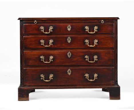 A GEORGE II MAHOGANY CHEST OF DRAWERS  IN THE MANNER OF THOMAS CHIPPENDALE, CIRCA 1755 With brushing slide 81cm high, 99.5cm 