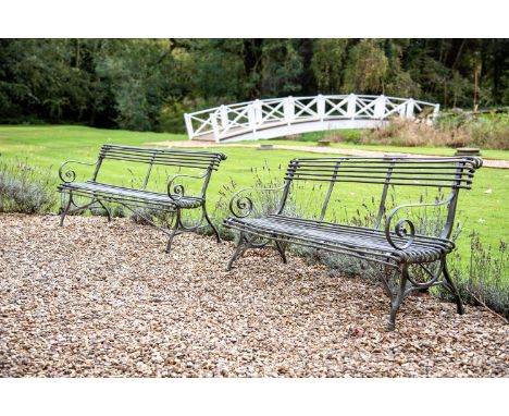 A PAIR OF FRENCH WROUGHT, CAST AND BENT IRON GARDEN BENCHES ATTRIBUTED TO THE SAINT SAUVEUR FACTORY, ARRAS, EARLY 20TH CENTUR