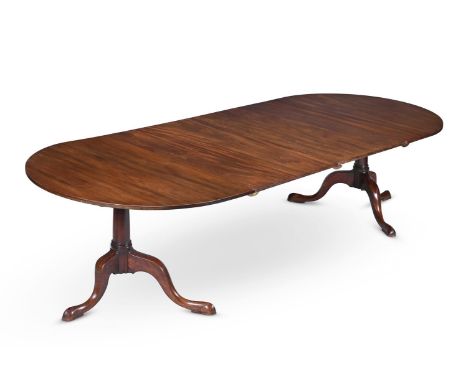 A MAHOGANY TWIN PEDESTAL DINING TABLE  LATE 18TH CENTURY AND LATER With two additional leaf insertions, bearing Norman Adams 