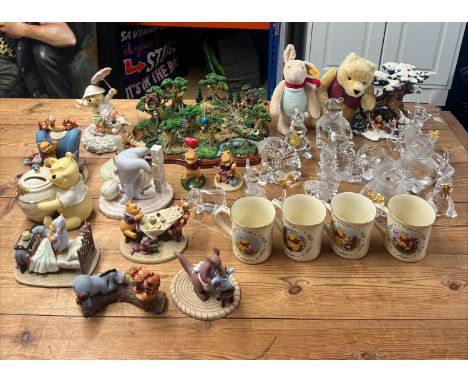 Collection of Winnie the Pooh related items; including 21 figurines -&nbsp; (10) A.A Milne and E.H. Shepard and ( 11) crystal