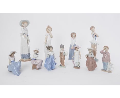 A collection of eleven Nao figures including 'Boy with Football' and 'Girl with Puppy' etc (11).