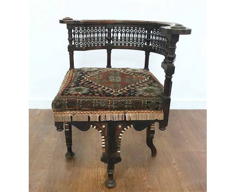 CARLO BUGATTI STYLE MOORISH CORNER CHAIR, late 19th century hardwood with mother of pearl and bone inlay, the spindle back ov