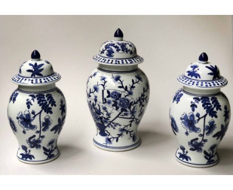 VASES, a pair of Chinese blue and white ceramic ginger jar vases with lids together with a larger example, 36cm H x 40cm H. (