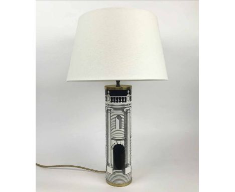FORNASETTI TABLE LAMP, cylindrical ceramic form with lithographic transfer print and brass fittings, 60cm H including shade.