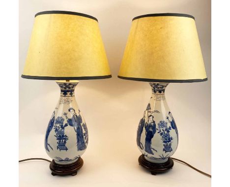 TABLE LAMPS, a pair, Chinese blue and white ceramic vase form, with carved hardwood bases and shades, purchased from the Altf