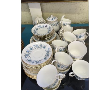 The residue of an extensive Colclough bone china tea service, decorated in a blue floral pattern.