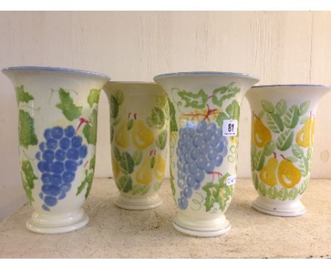 A set of four Poole Pottery vases, decorated in Pears and Grape patterns.