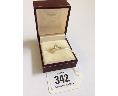 An 18 carat gold marquise set diamond solitaire ring.