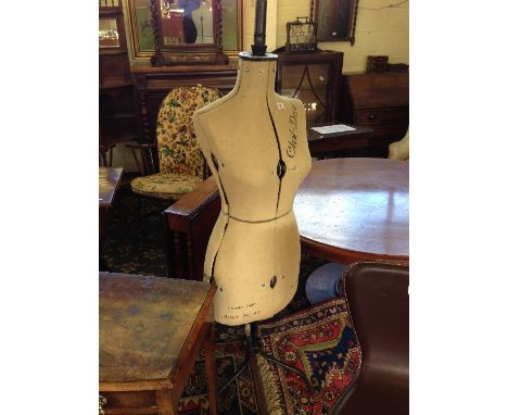 An early 20th century dress maker's mannequin on metal stand.