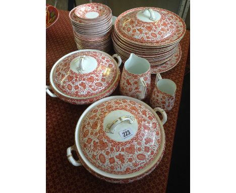 The residue of an early 20th century Royal Crown Derby china dinner and tea service decorated in a stylised orange pattern.