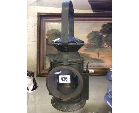 A 1950's Military green painted metal signal lamp, impressed C. F. & S., circa 1956.