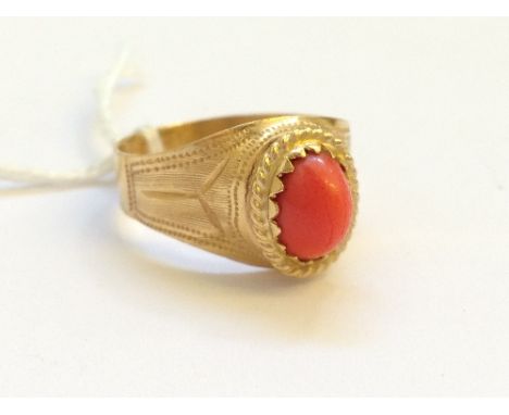 An 18 carat gold coral set dress ring (4.1 grams).