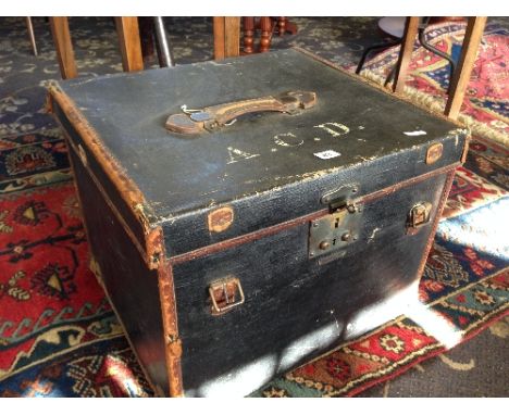 A late 19th century canvas and leather trunk.