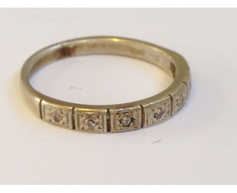 An 18 carat white gold half eternity diamond set ring.