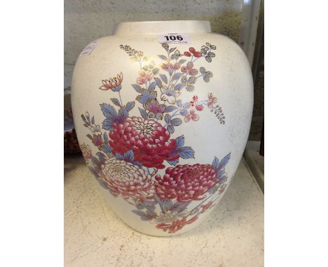 A Poole Pottery lustre vase decorated with flowers.