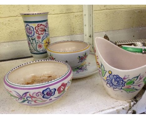 Five various white bodied Poole Pottery items.